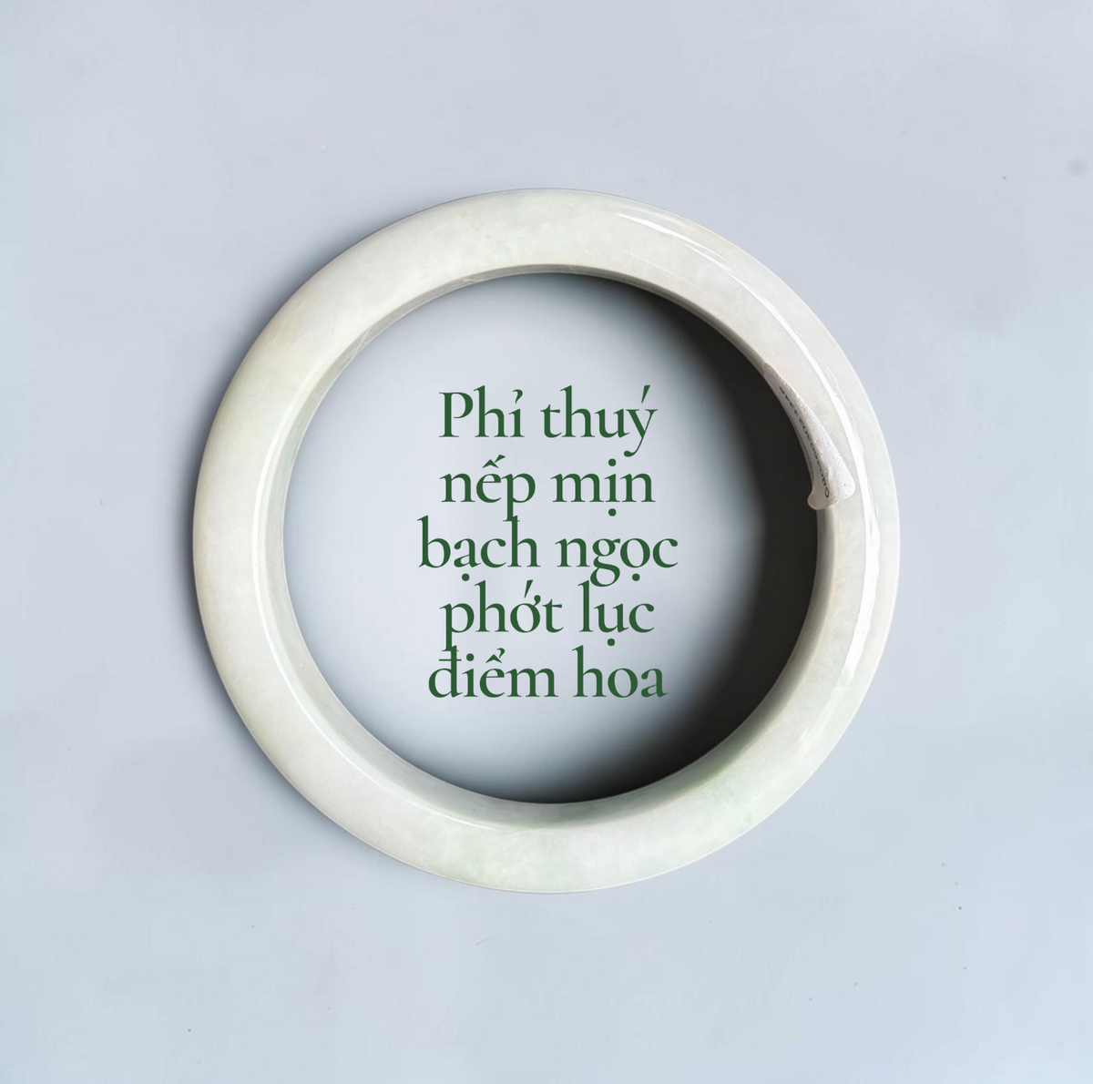Fine-textured white jadeite with soft green hues and delicate floating floral inclusions - Phỉ thúy nếp mịn bạch ngọc phớt lục điểm hoa