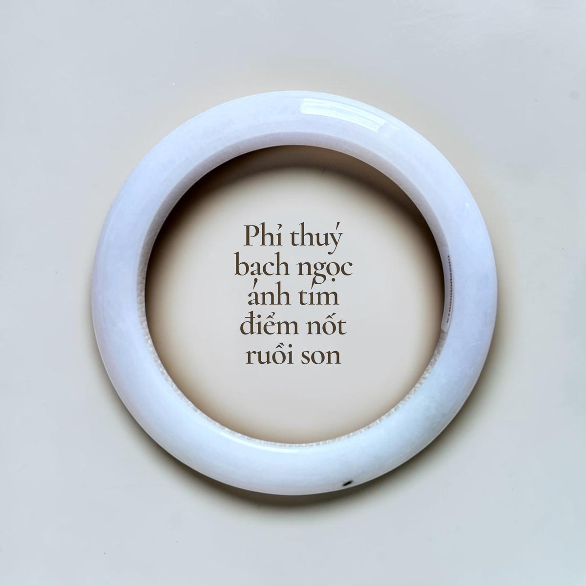 White jadeite with soft lavender hues and a distinctive vermilion-red “beauty mark” inclusion - Phỉ thúy bạch ngọc ánh tím điểm nốt ruồi son