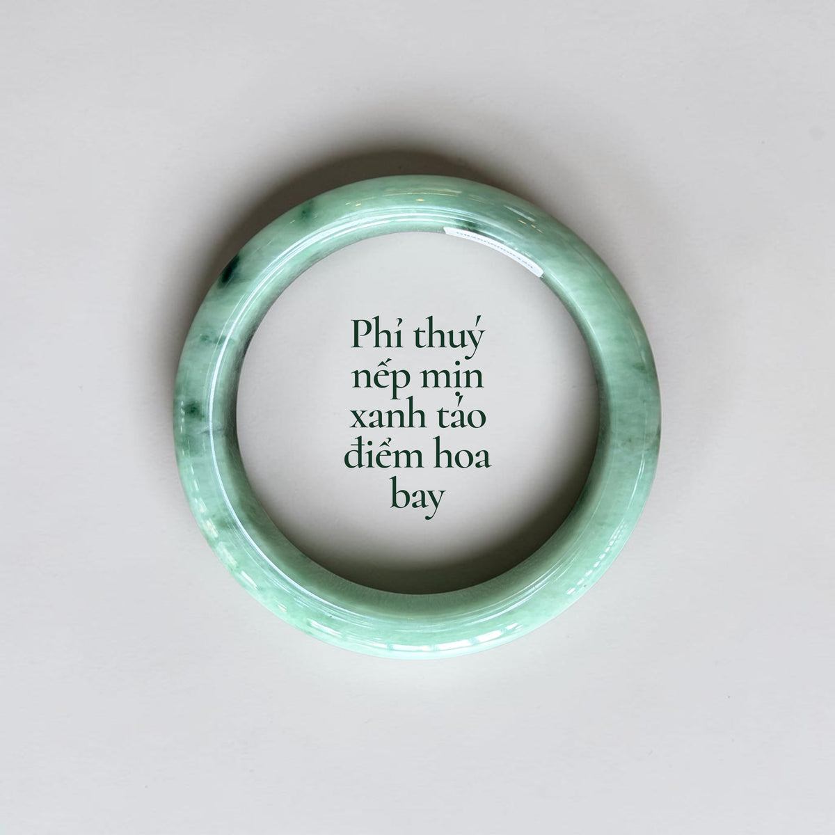 Fine-textured apple-green jadeite with delicate floating floral inclusions - Phỉ thúy nếp mịn xanh táo điểm hoa bay
